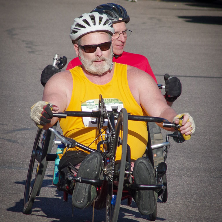 Marathon participants on a recumbent bicycle